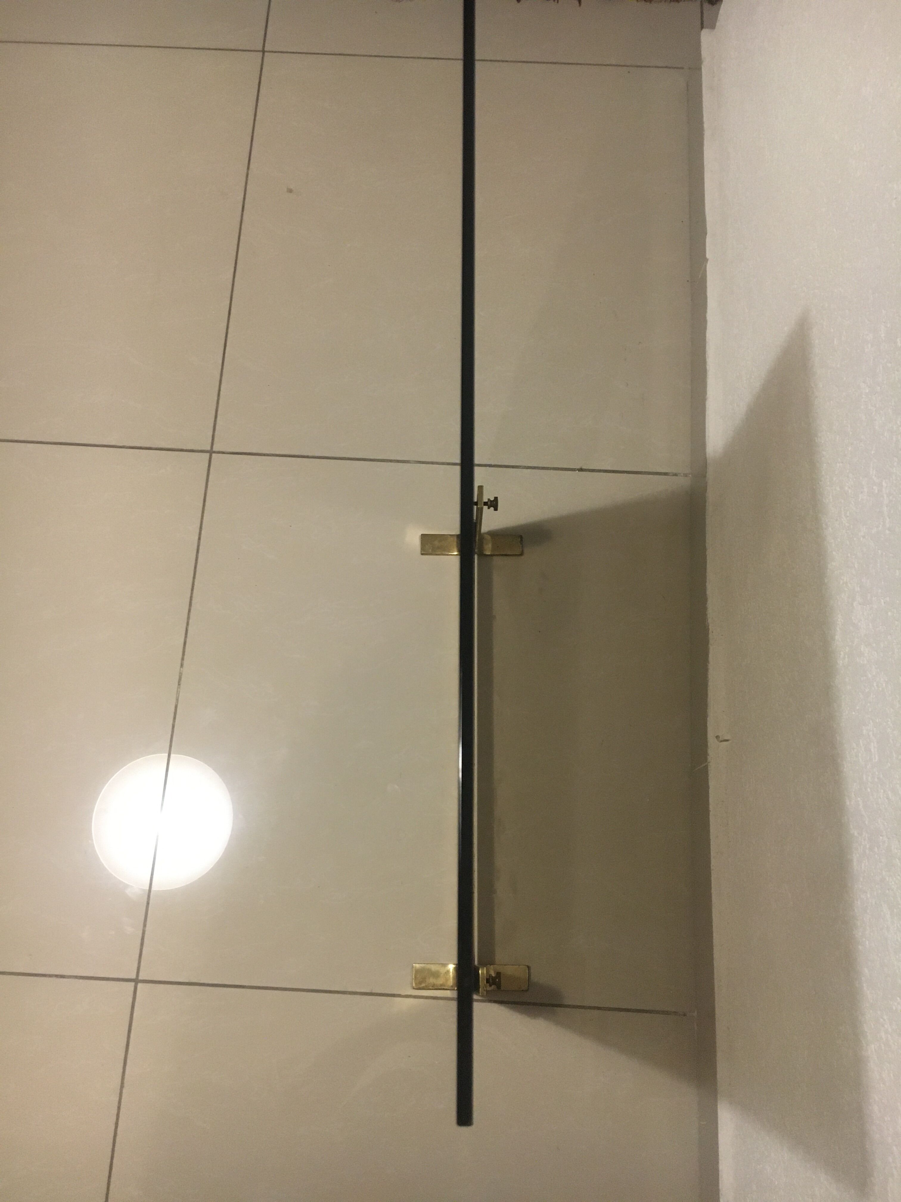 Fireplace screen in smoked glass and brass