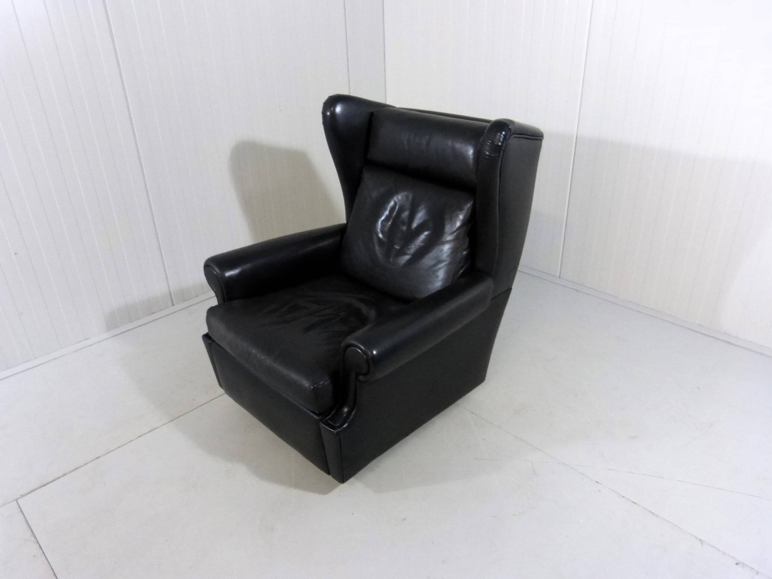 Black leather wingback chair on wheels 1960’s