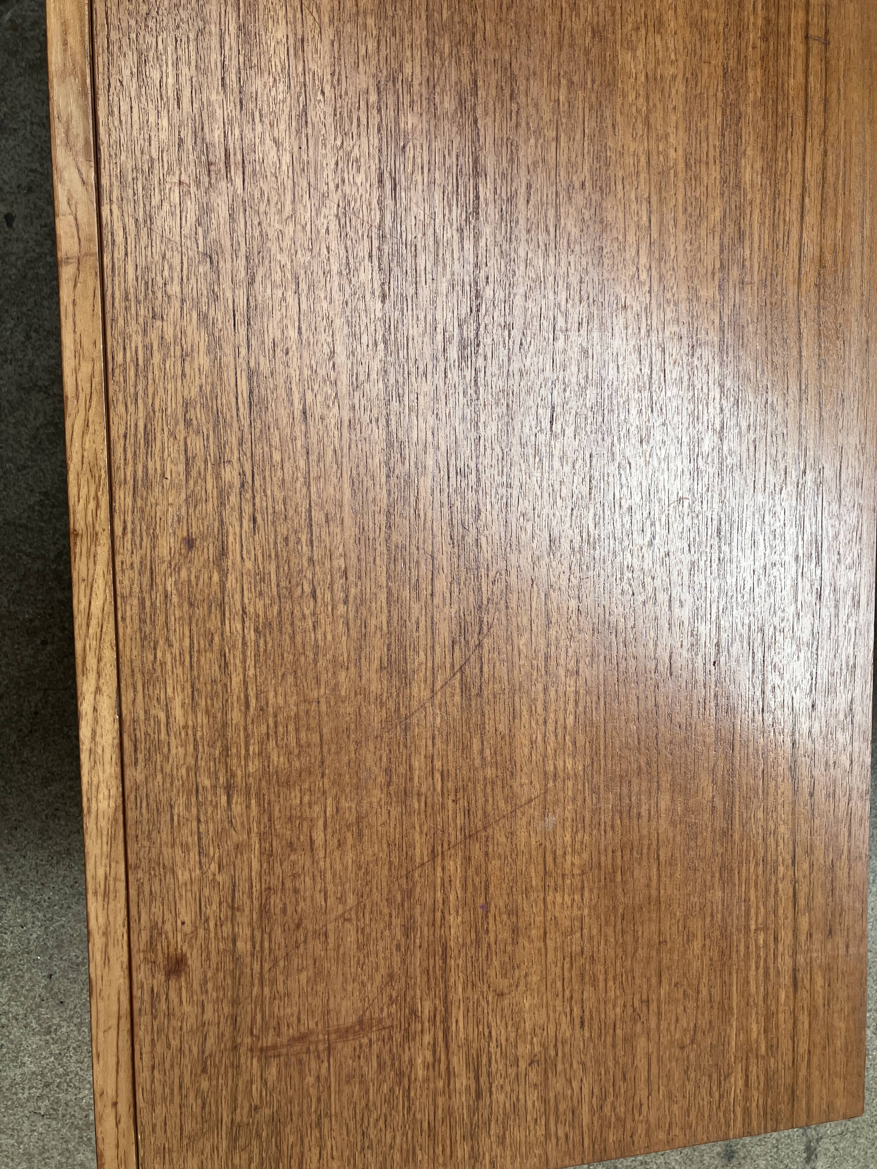 Teak sideboard with flap, 2 drawers and conical legs.