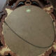 Ancient witch's eye mirror Dollanzo Italy in gilded wood