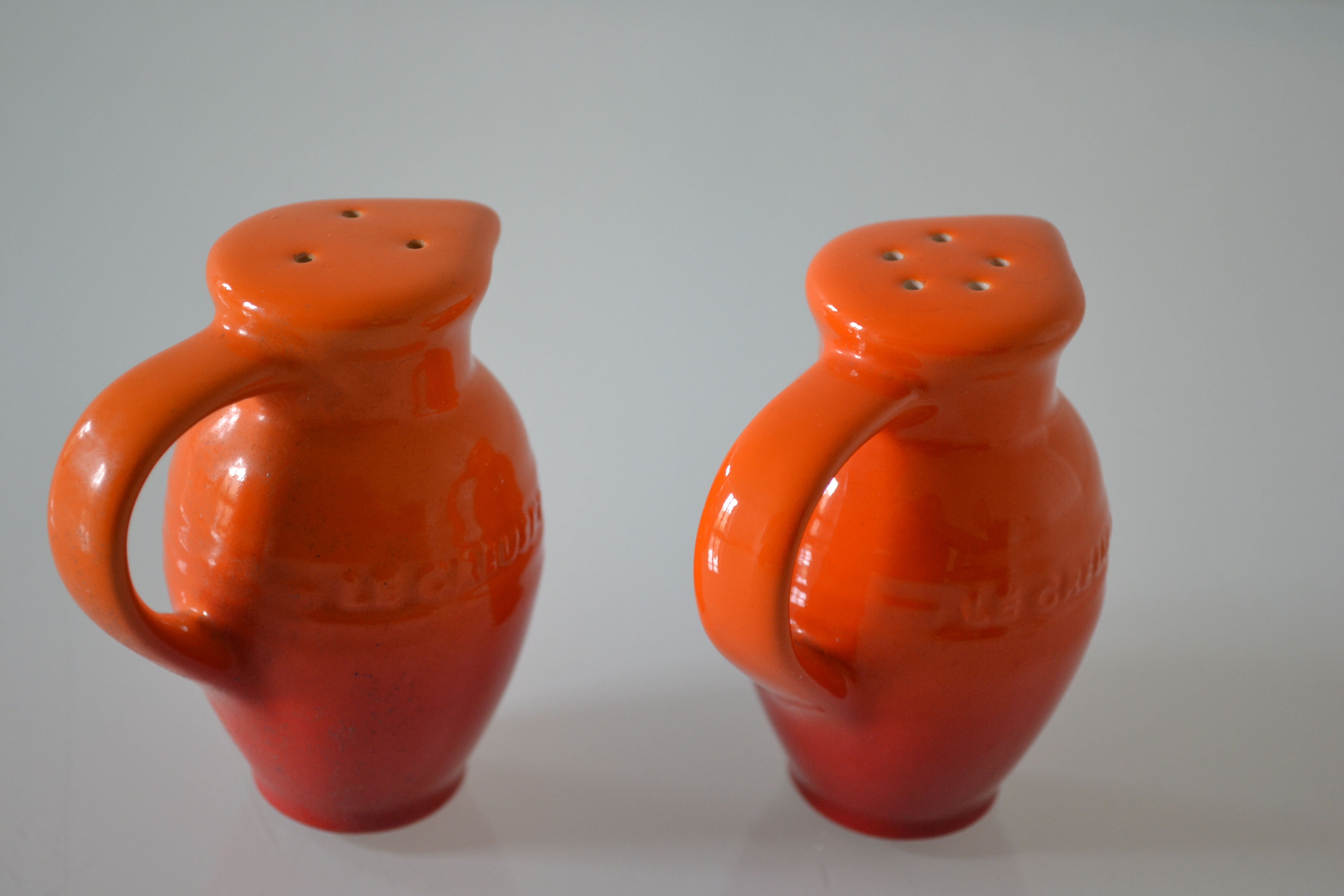 Le Creuset orange advertising salt and pepper