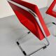 2 chaises tubulaire en simili rouge, années 80 en simili rouge