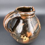 Signed black and red glazed stoneware pitcher, French artisanal ceramics