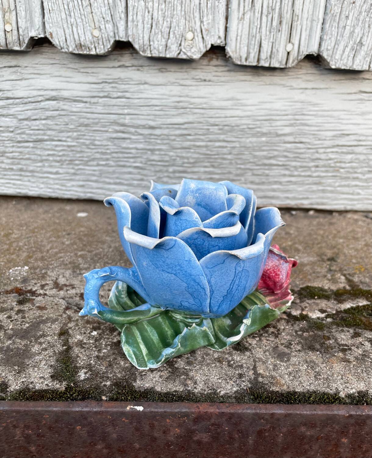 Old barbotine candle holder in the shape of a rose