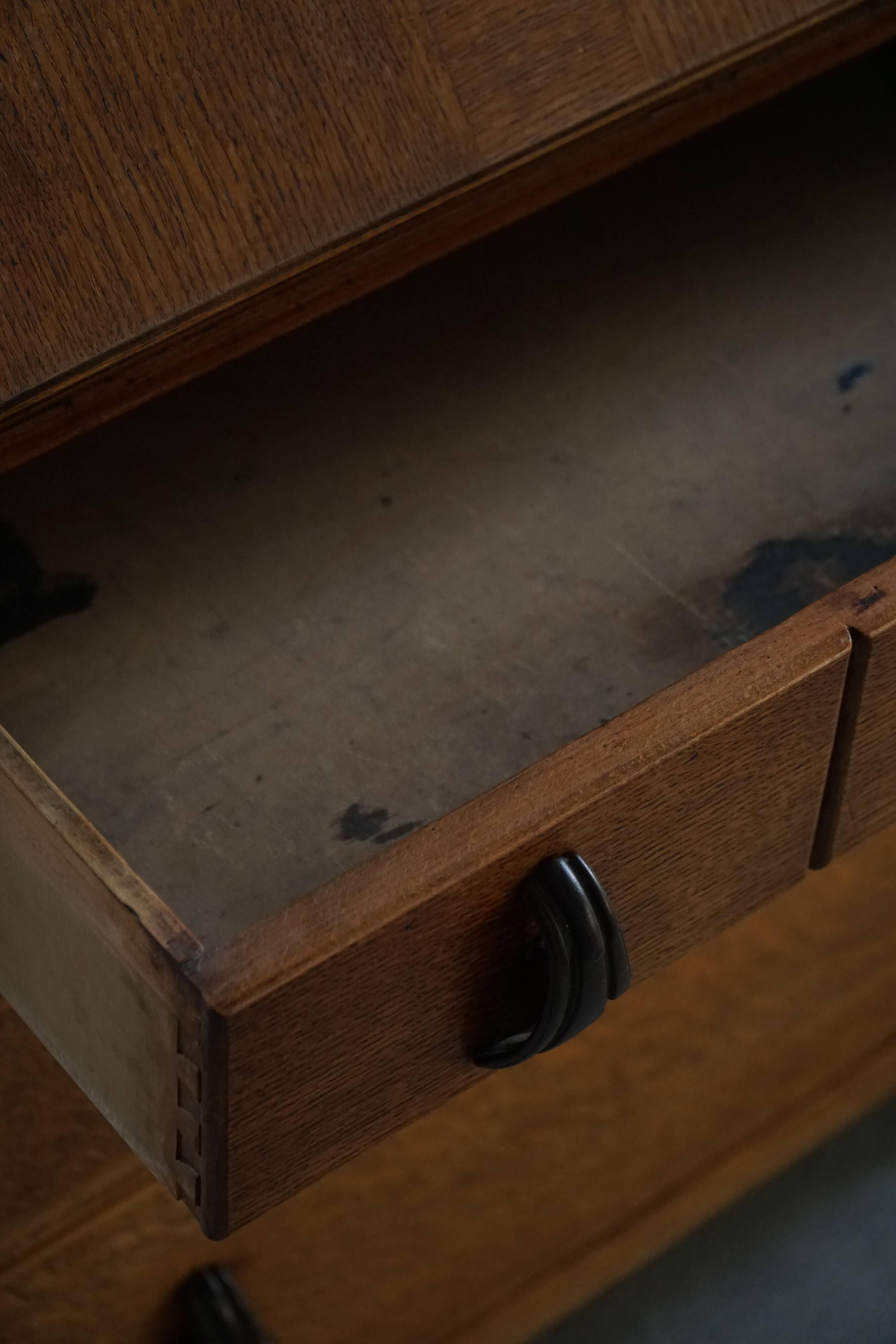 Desk / Chest of drawers in modern Danish oak from the early 20th century with shell handles.