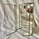 Small vintage display case in clear glass, mirrored glass and brass