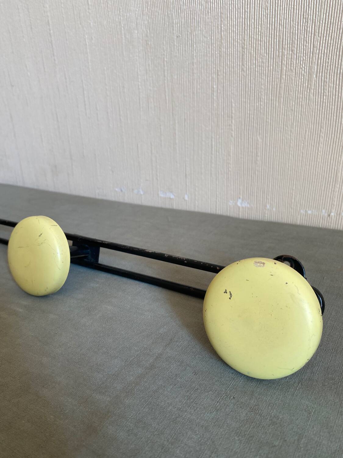2 black and yellow metal wall coat racks
