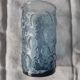 Blue glass with fruit relief decoration