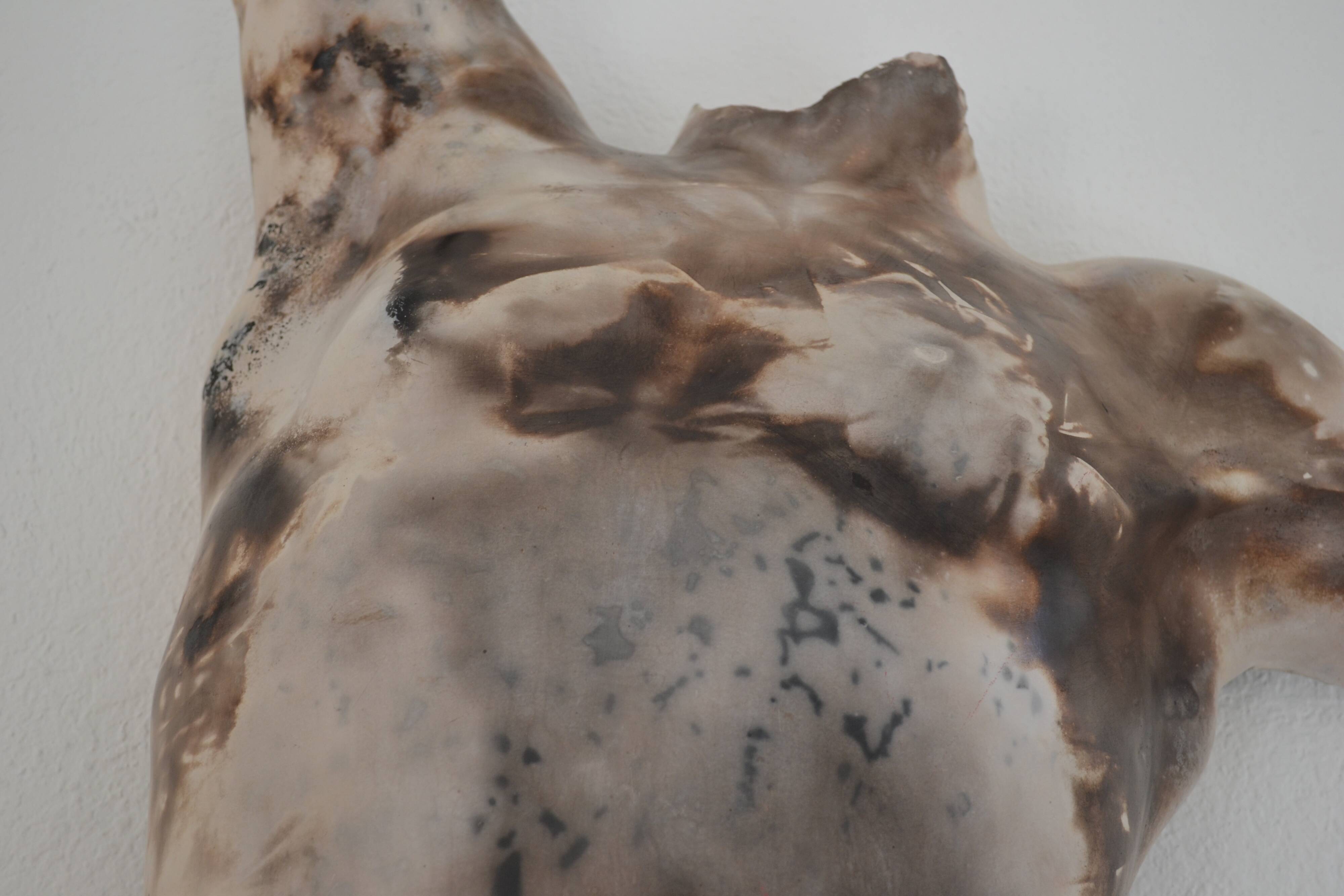 Male torso sculpture by patinated casting, signed to be identified.