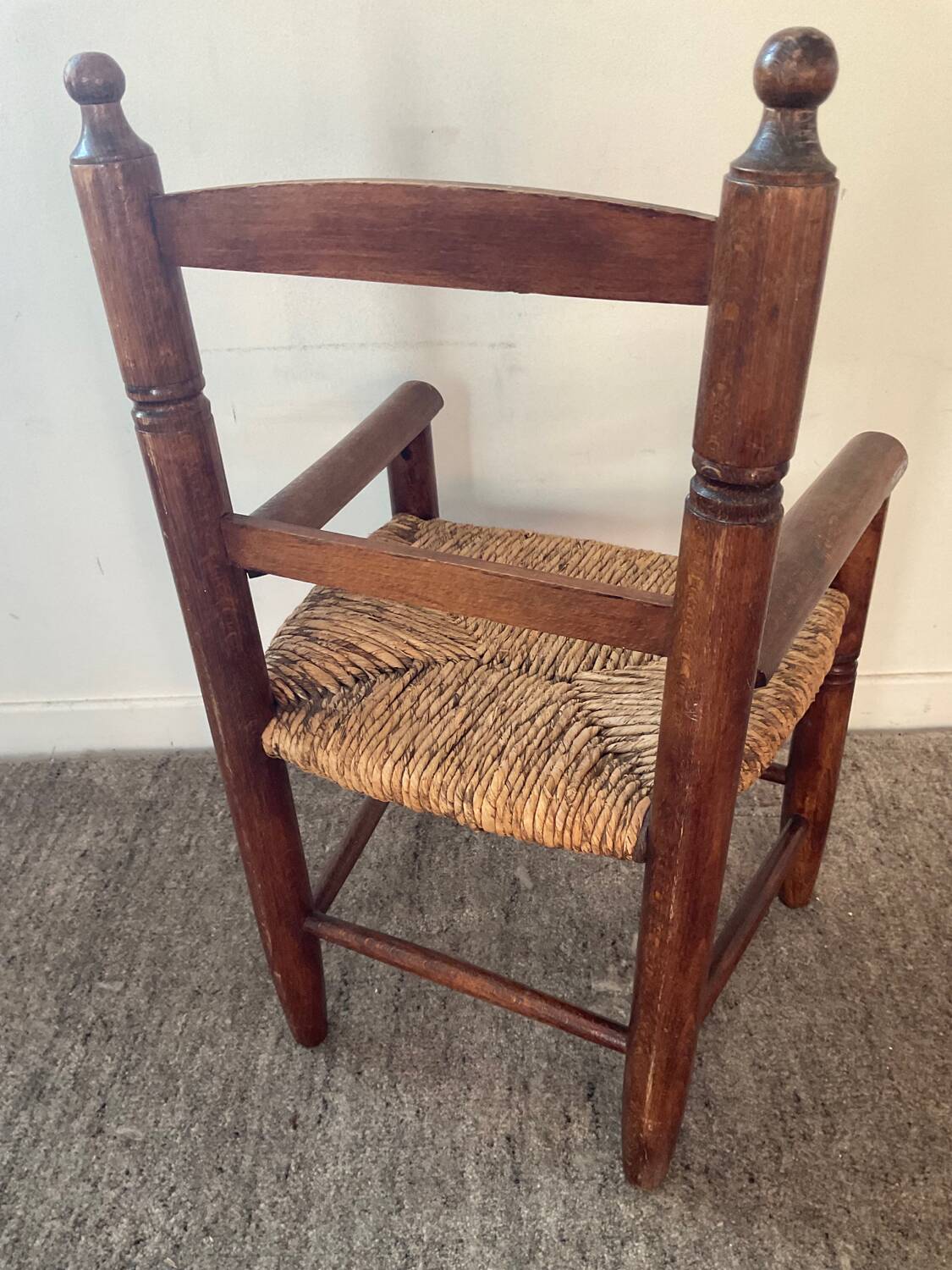 Vintage wooden armchair and straw seat for children