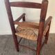 Vintage wooden armchair and straw seat for children