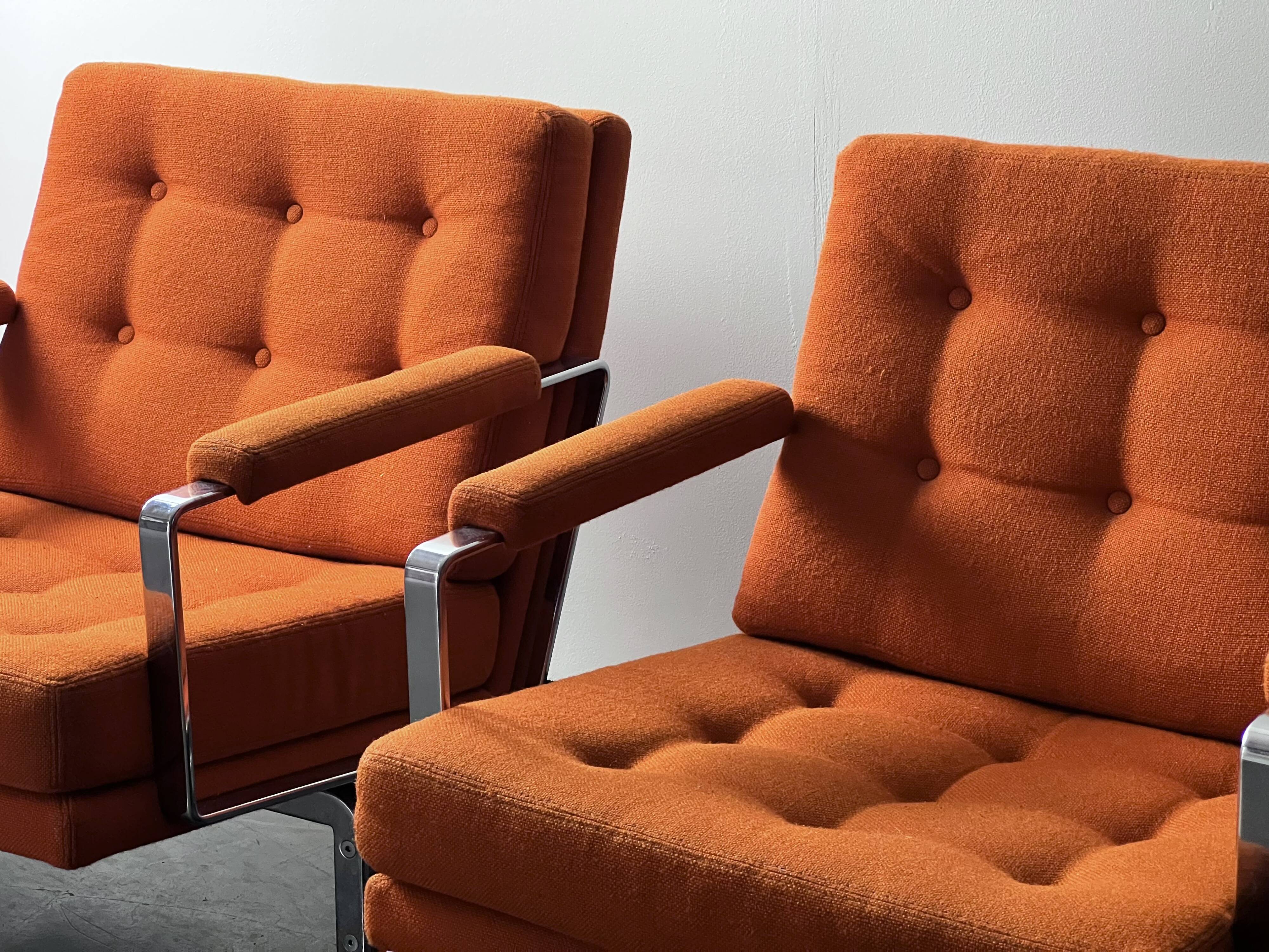 Pair of Karl Erik Ekselius armchair, in orange and chrome Kadrat fabric