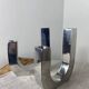 Designer candle holders in brushed aluminum