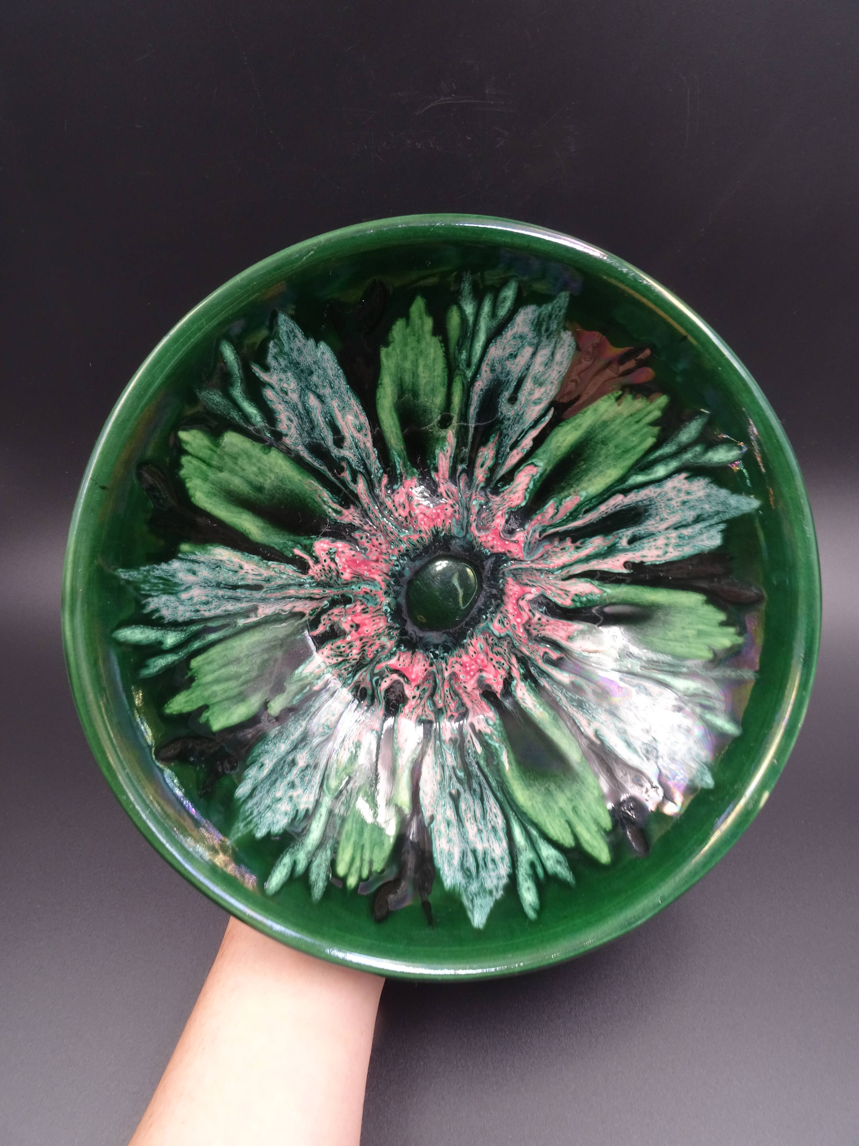Green faience bowl decorated with multicolored drips around 1970