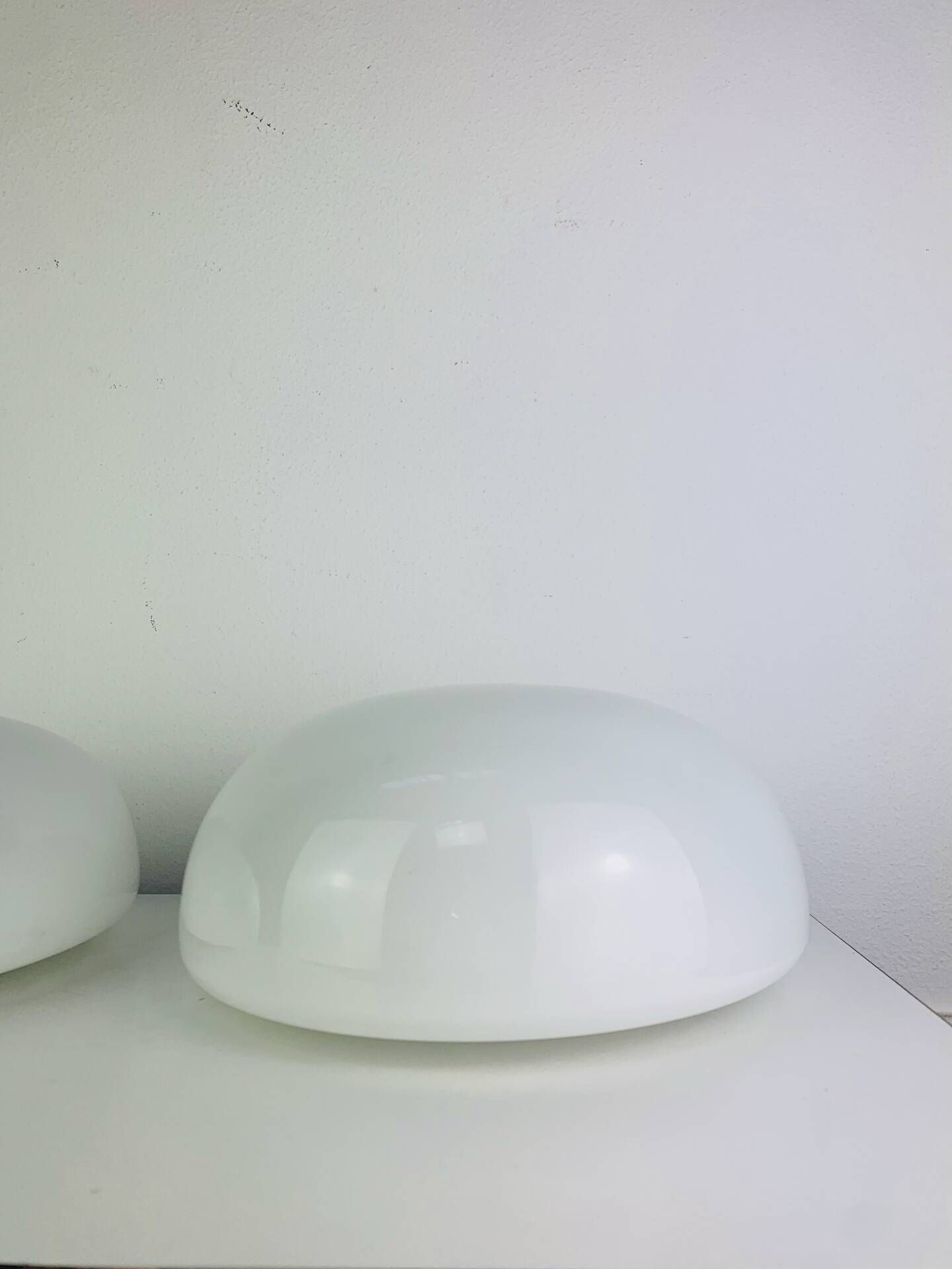 Pair of half-sphere wall lights in white opaline, Italy 1960