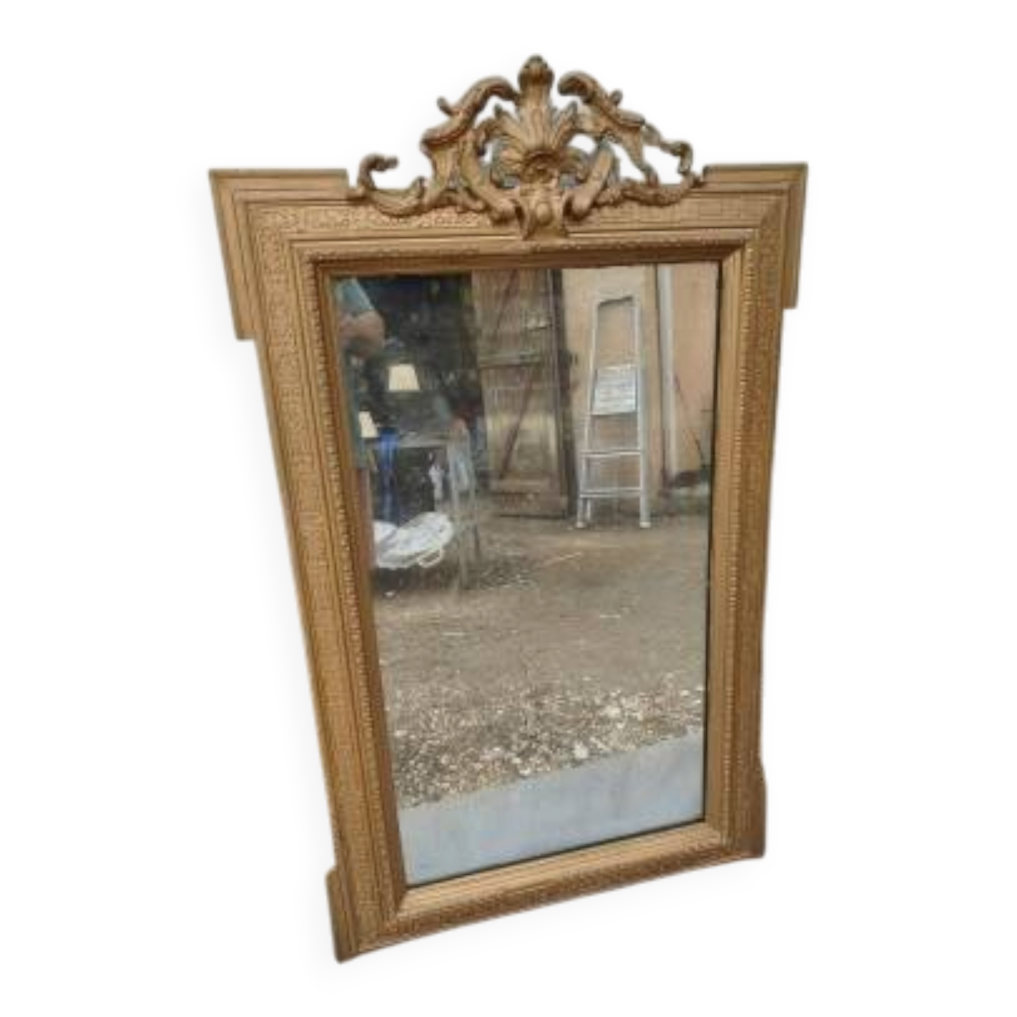 19th-century mirror in gilded wood and stucco.