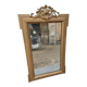 19th-century mirror in gilded wood and stucco.