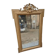 19th-century mirror in gilded wood and stucco.