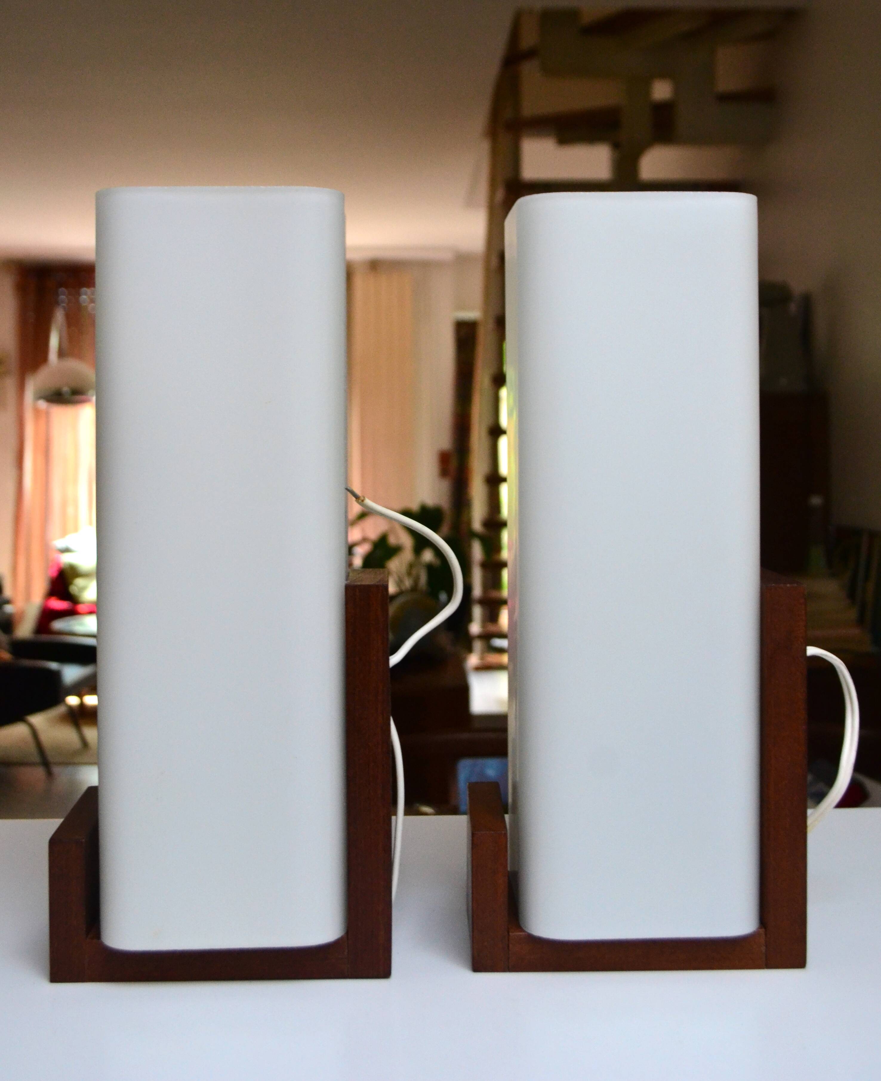 Pair of Louis Kalff wall lights, teak opalines from the 50s/60s.