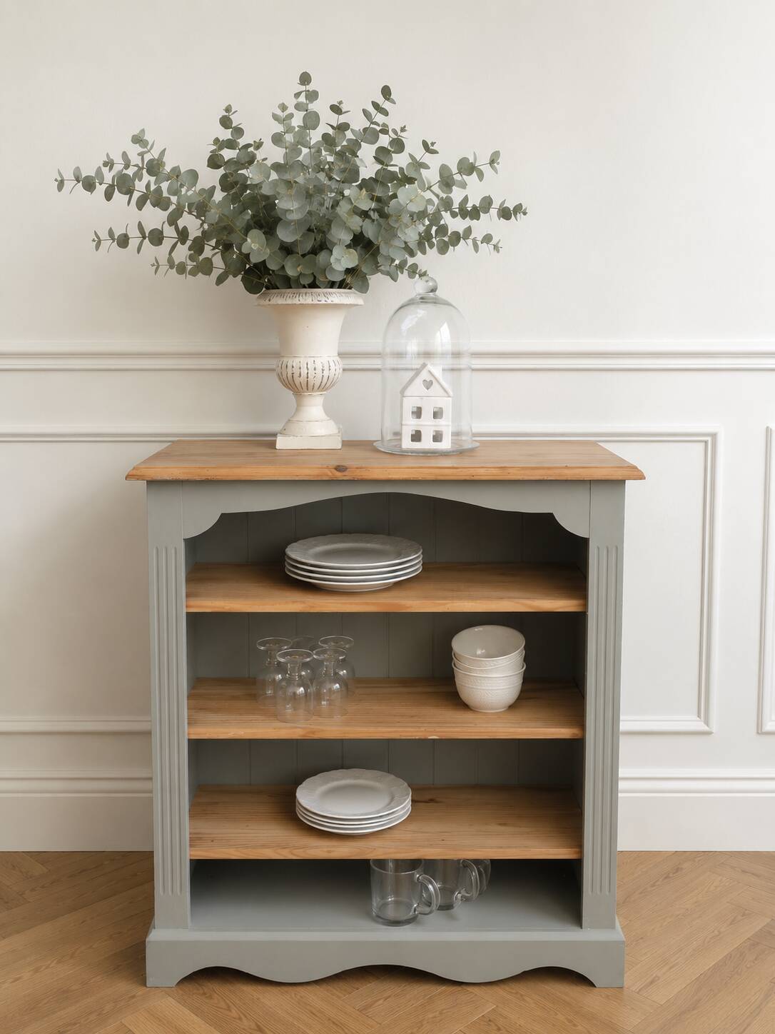 Green-grey library, wooden shelf and shelves in natural wood.