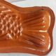 Old glazed terracotta mold, fish shape, Alsace