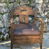 Pair of armchairs in stained wood and leather, 20th century