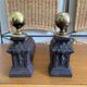 Pair of antique bedside tables in cast iron and brass.