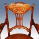 19th century armchair in leather and rosewood inlaid with brass and rosewood