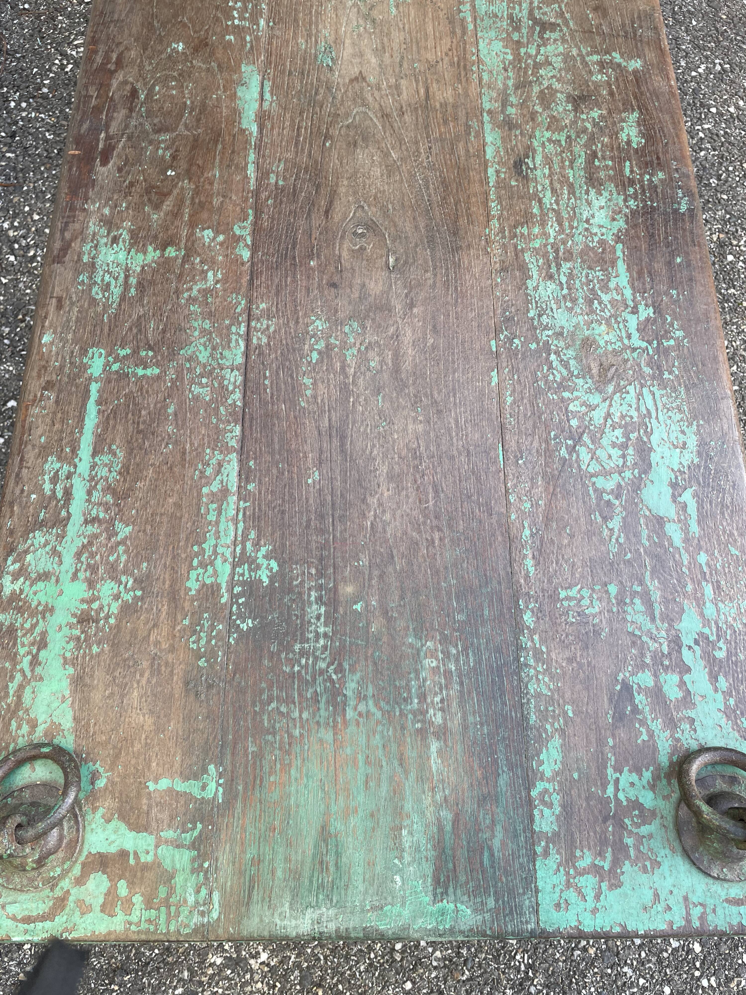 Pair of green teak coffee tables.