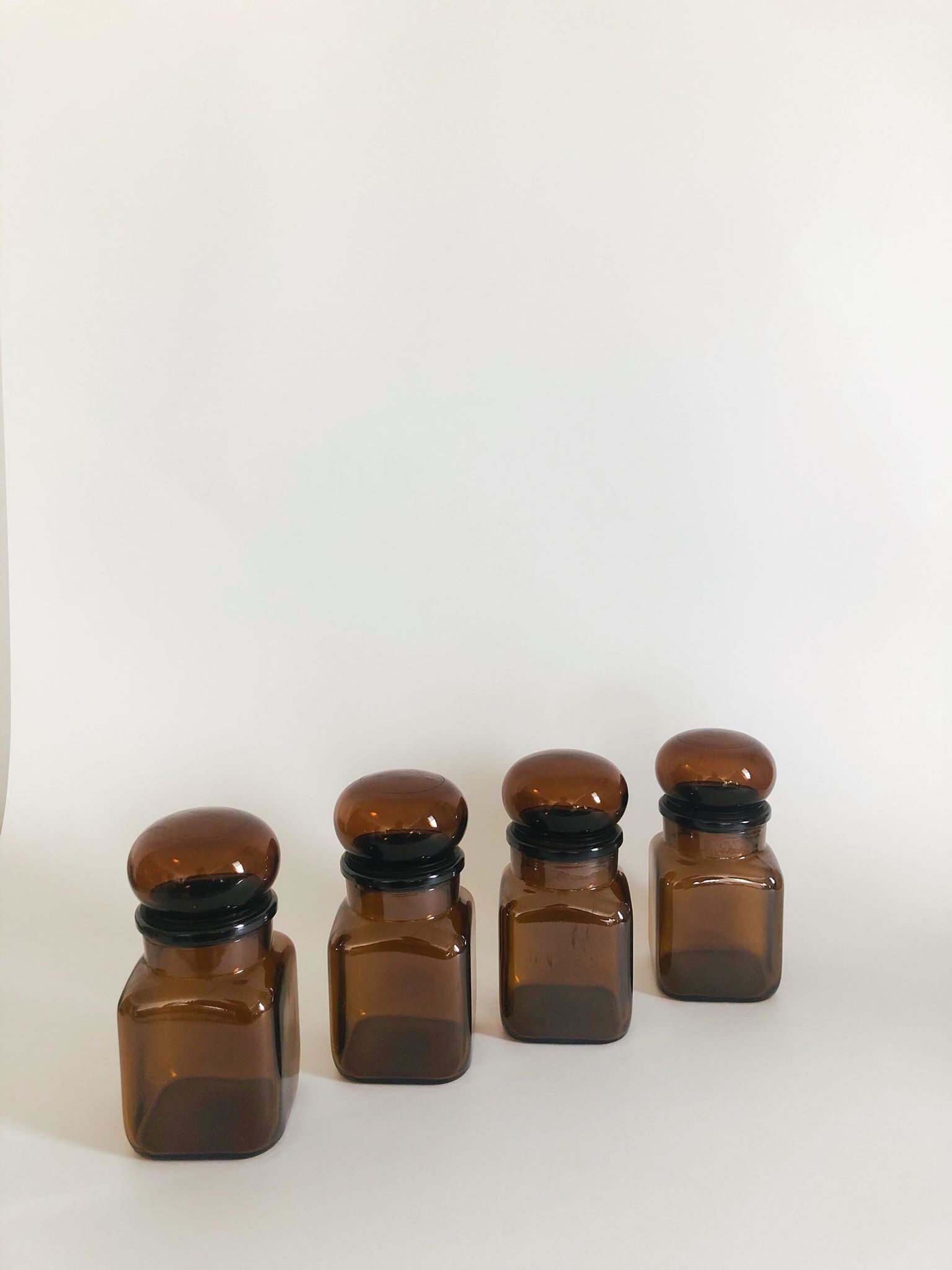 Lot of 4 bottles of amber glass apothecary style