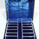12 silver-plated metal knife handles, in a case.