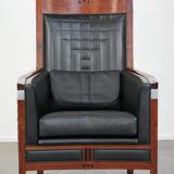 Art Deco design armchair with black leather with decorative stitching