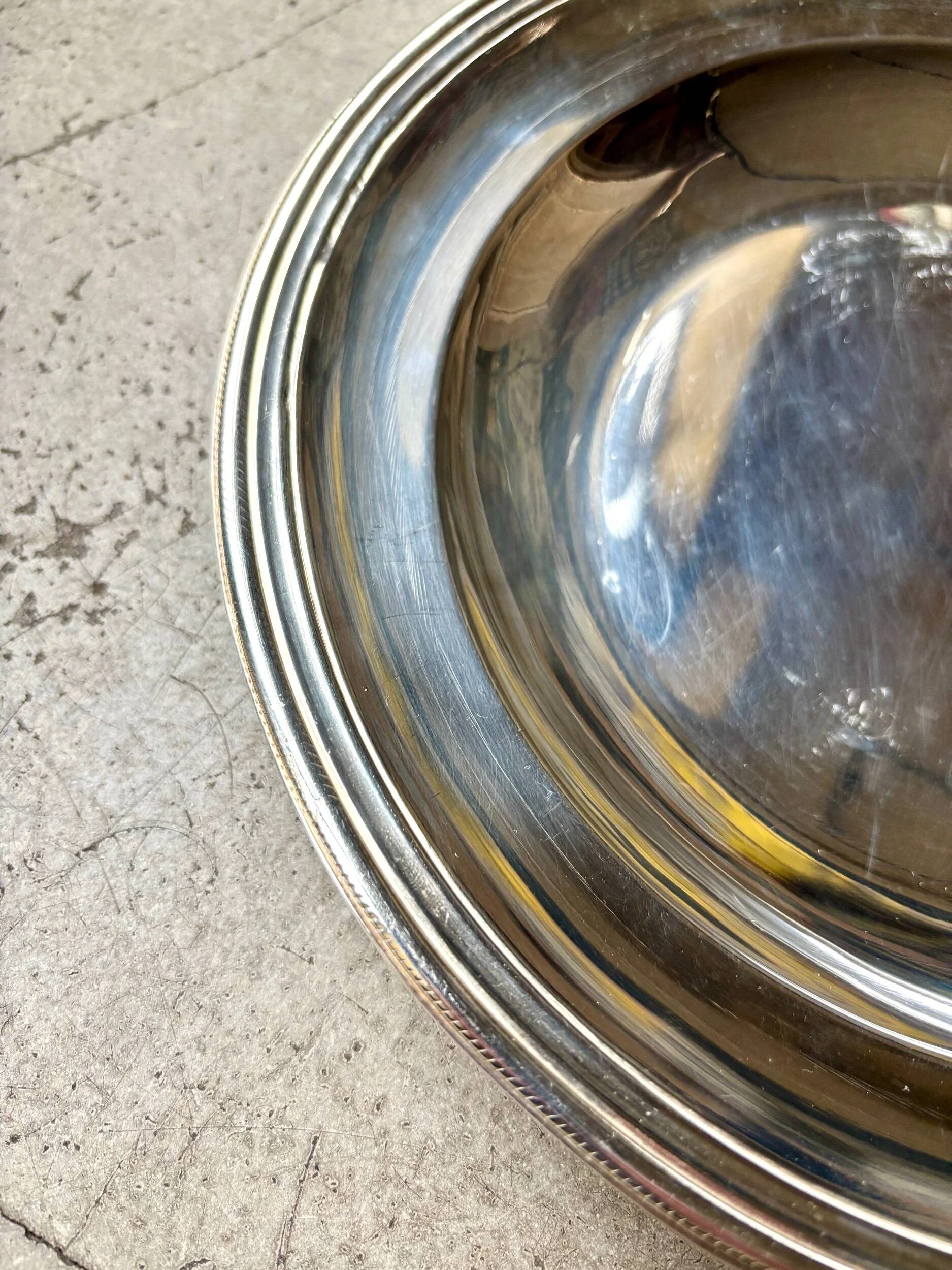 Round silver-plated metal dish