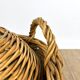 Old demijohn in her wicker basket