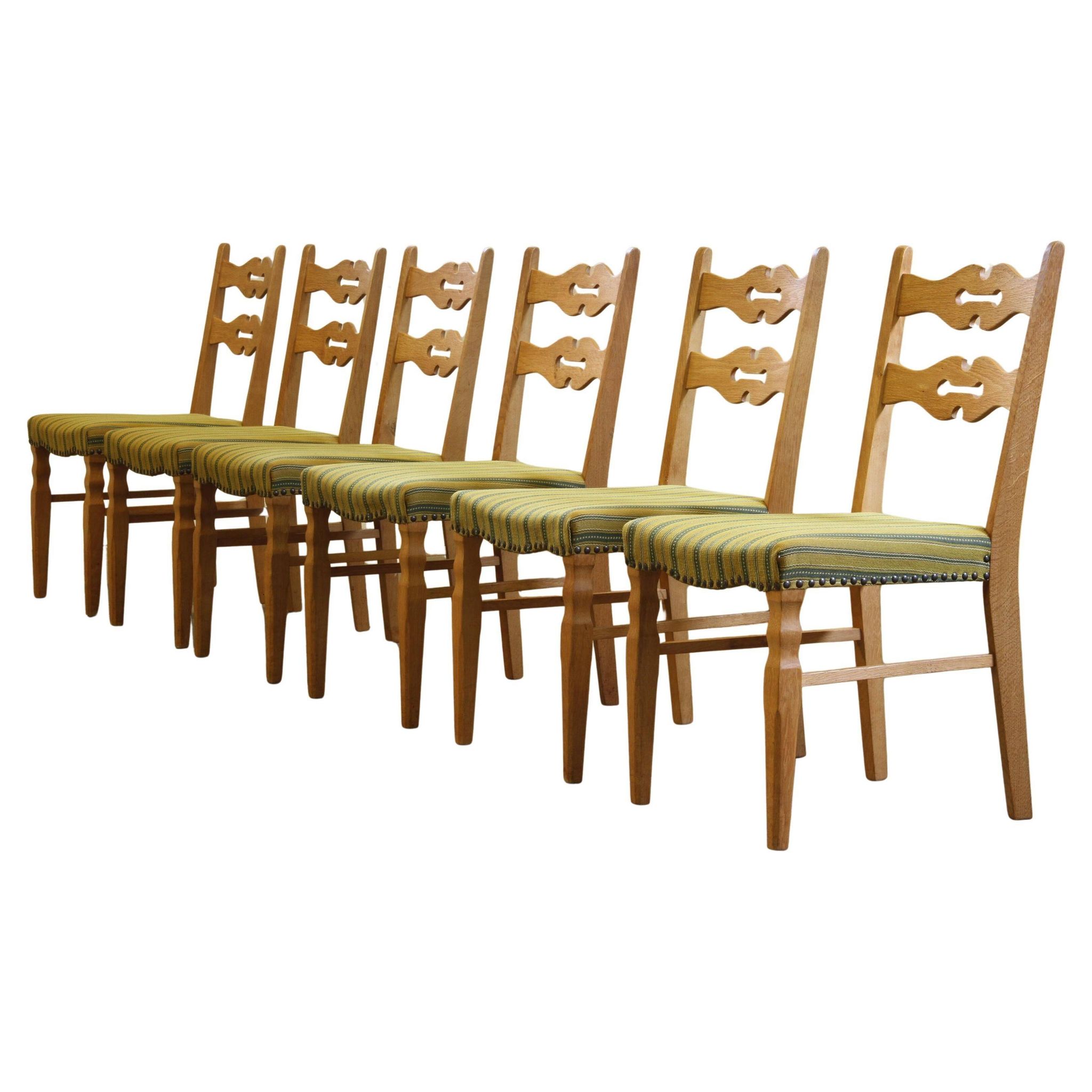 Vintage 1960s brutalist Danish modern oak dining chairs in the style of Henning Kjærnulf