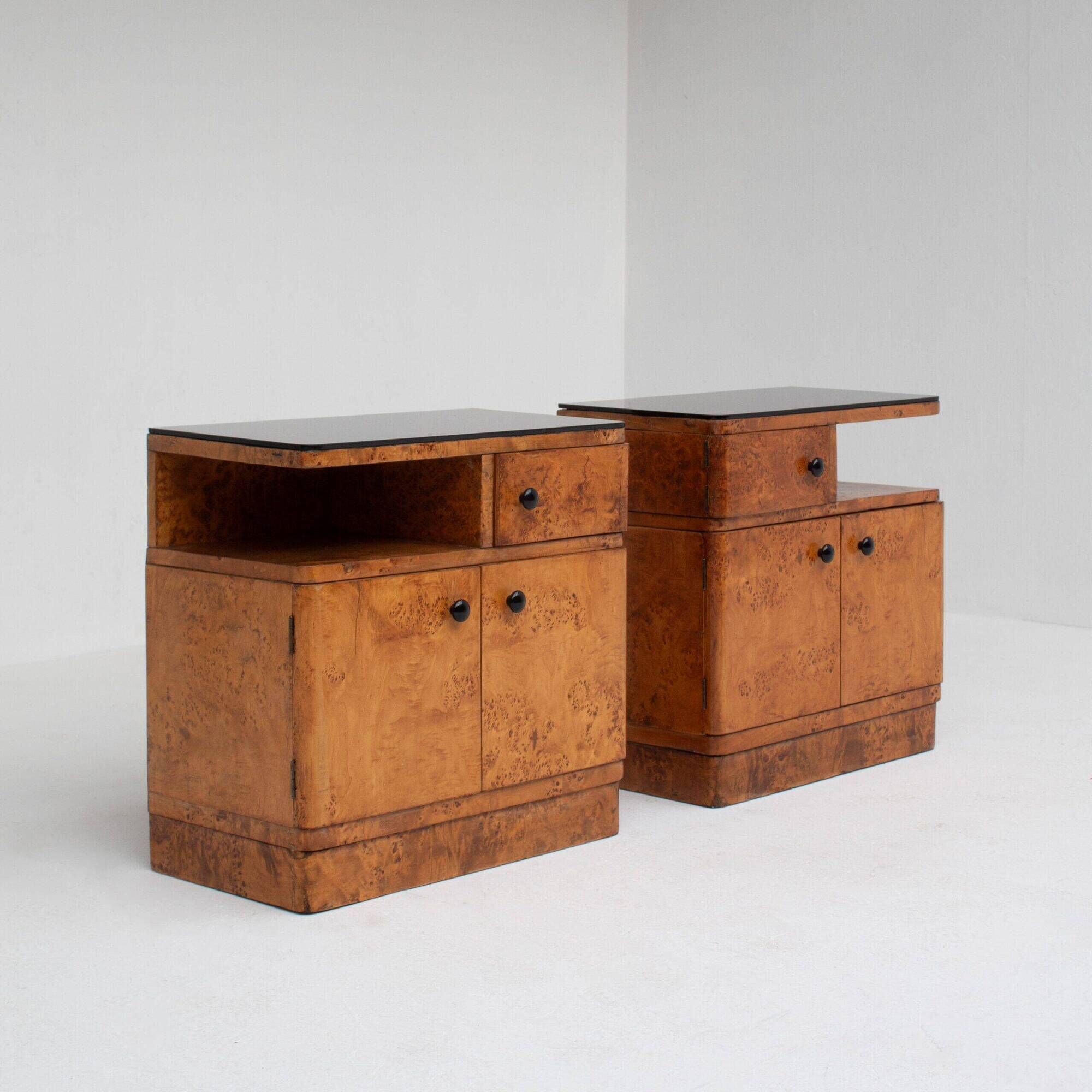 Pair of Art Deco nightstands in burlwood with black lacquered top