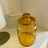 Old apothecary jar in blown amber glass