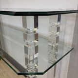 Hollywood Regency console style in travertine, glass, and Lucite.