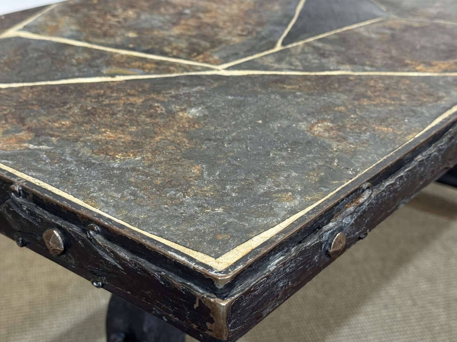 Coffee table in wrought iron with a slate top, work from the 1950s.