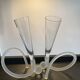 Pair of champagne glasses signed in glass paste