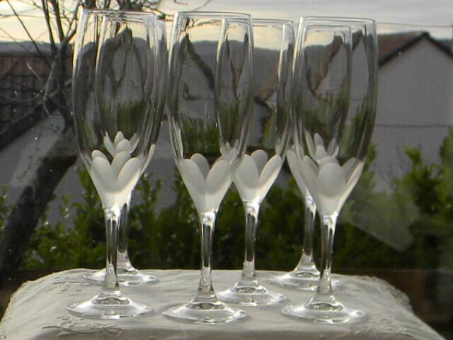 Set of 6 cut crystal flutes from lorraine.