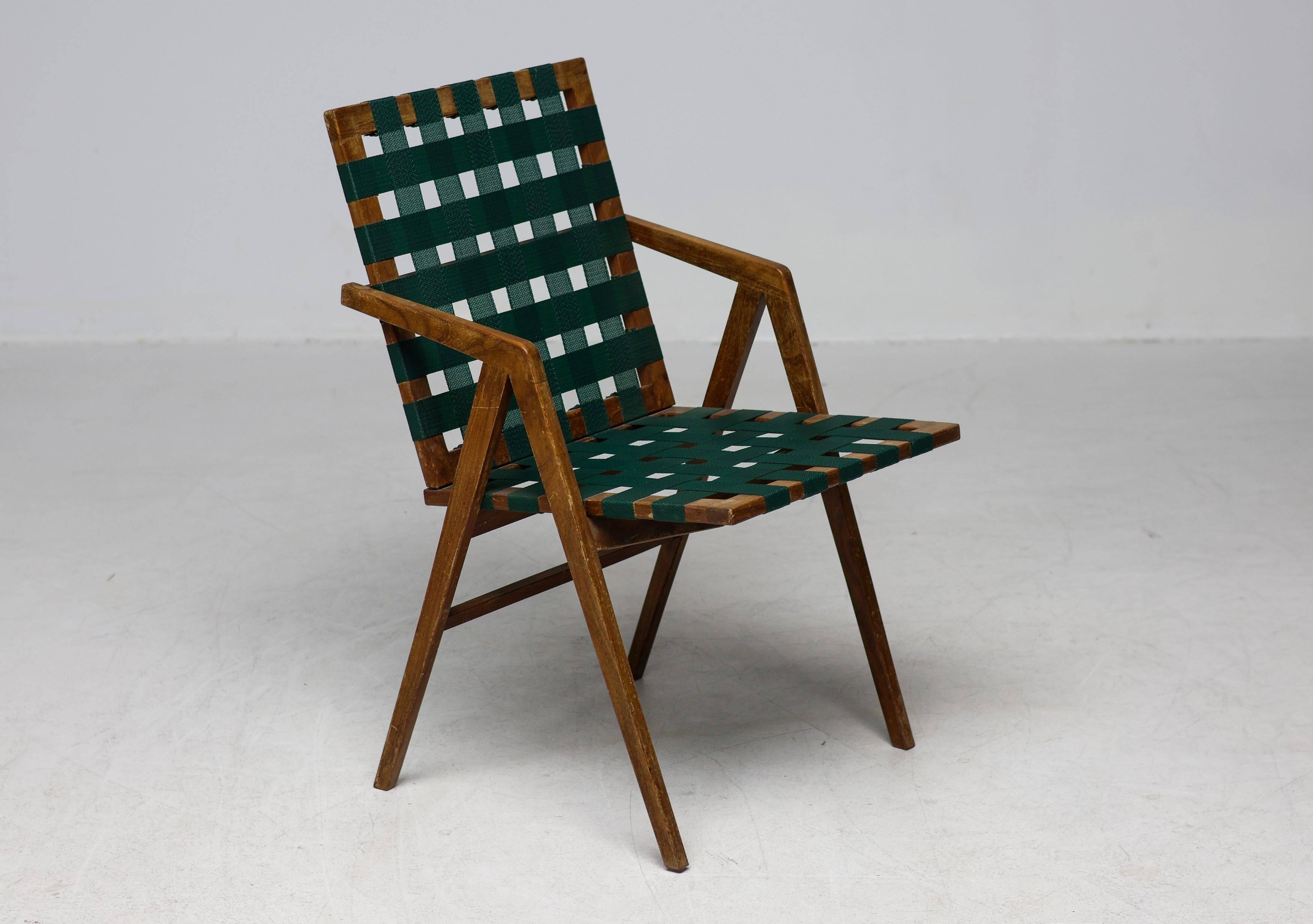Mid-century Italian armchair in walnut with straps, in the style of Franco Albini.