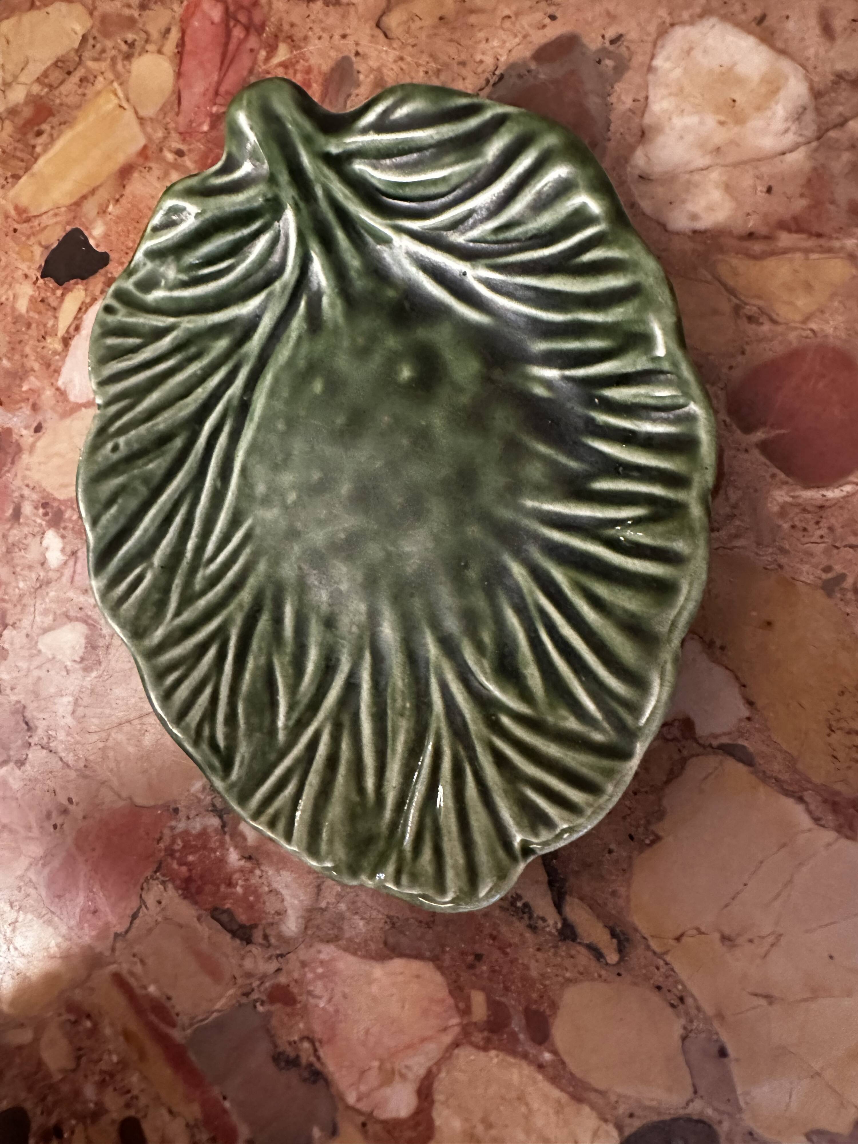 Vintage leaf-shaped green majolica catchall.