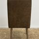 Upholstered armchair in brown imitation leather