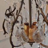 Small bronze "cage" chandelier with three lights decorated with tassels and pendant. Late 19th century