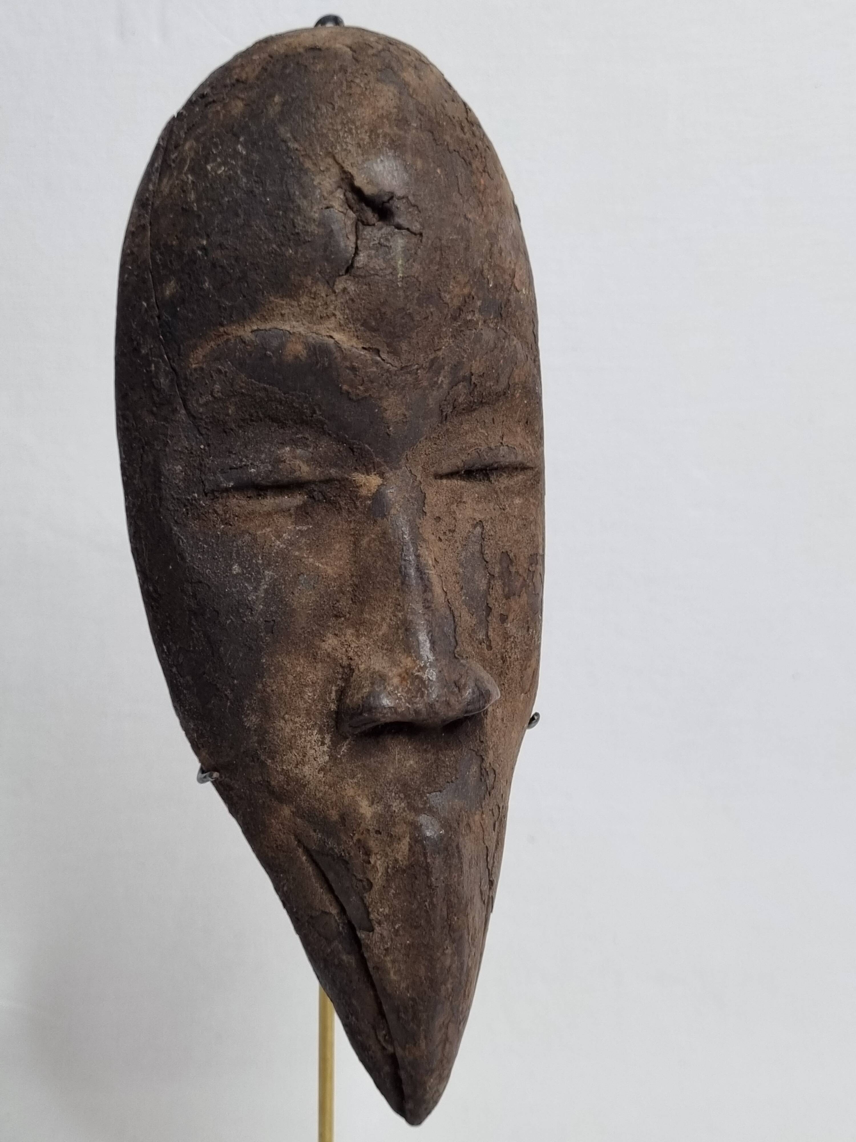 Antique African Dan Mahou passport mask with long beak, 19 cm