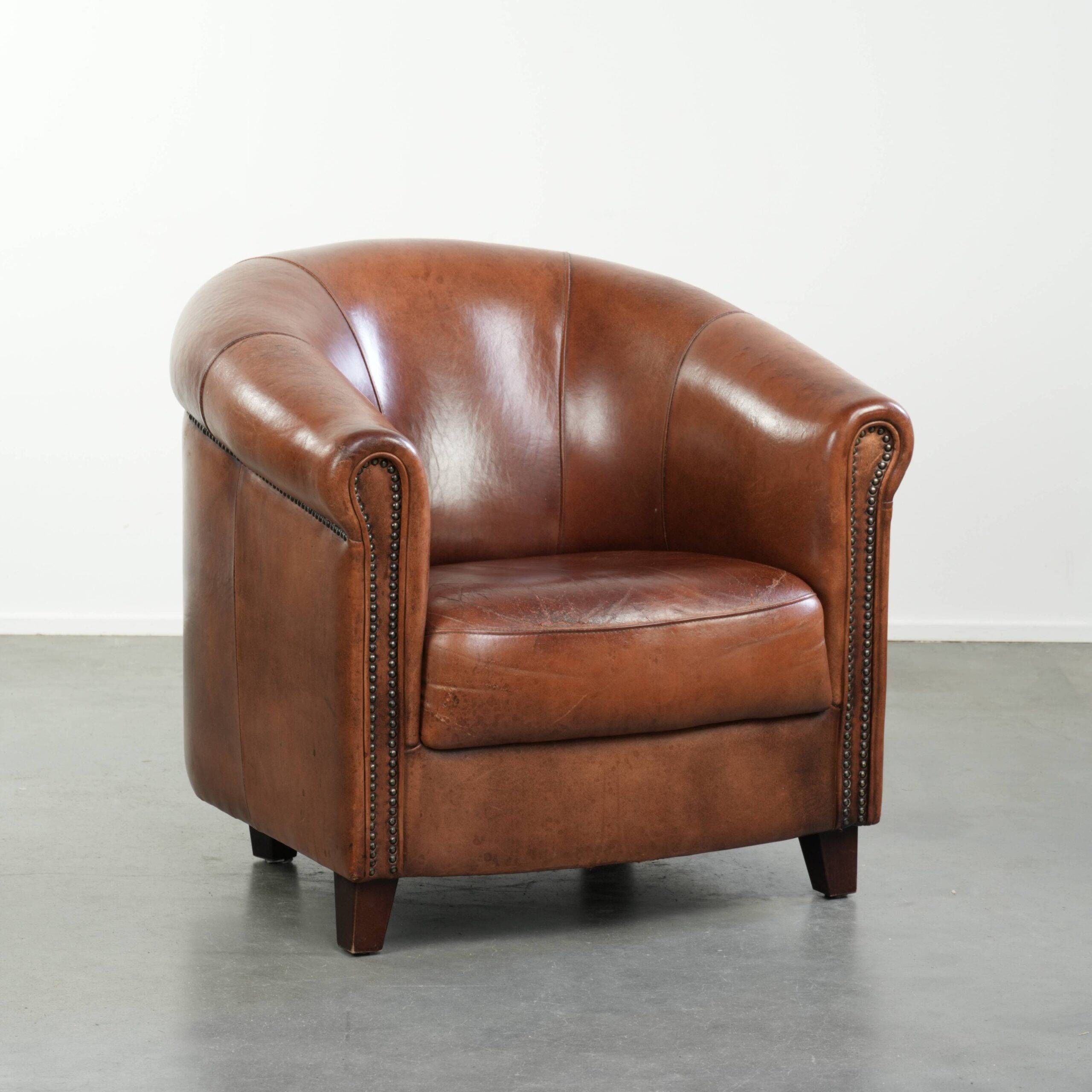 Vintage sheepskin club armchair in English style with deep colours