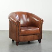 Vintage sheepskin club armchair in English style with deep colours