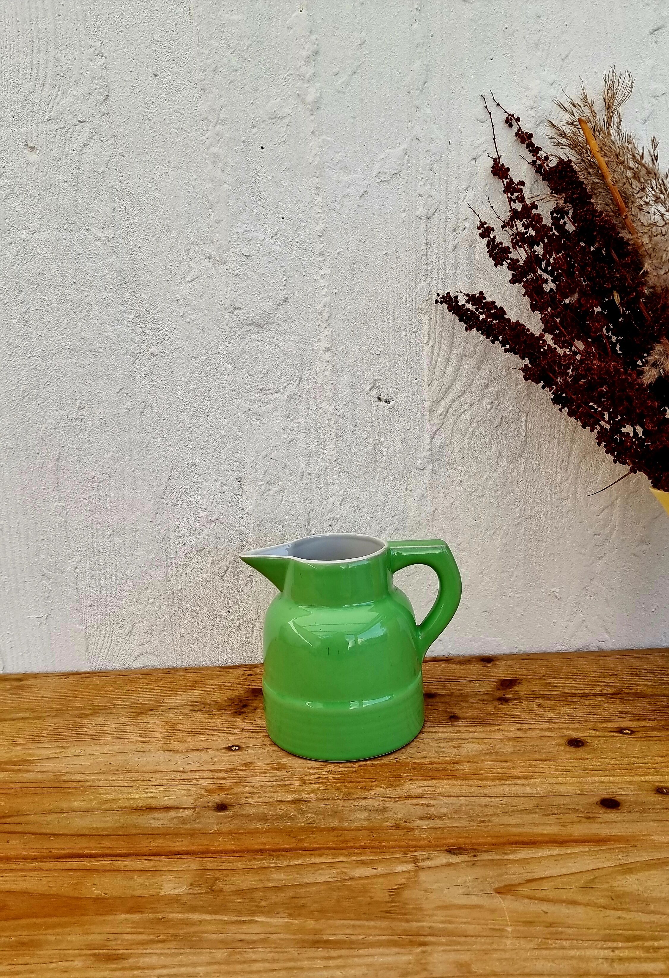 Vintage green earthenware pitcher