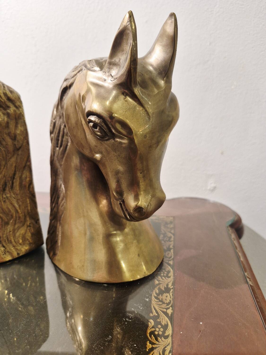 Serre livre têtes de cheval en laiton vintage